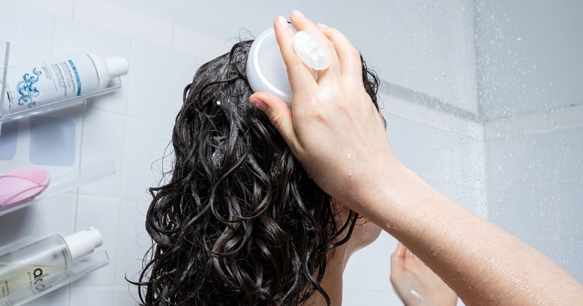 Why experts recommend adding a scalp massager or brush to your hair care routine