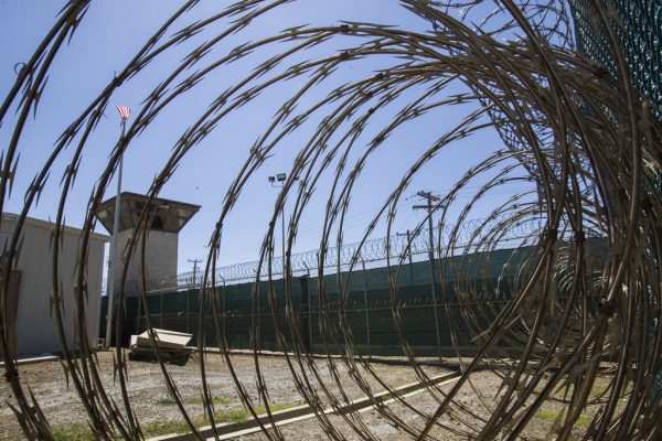 Should A Man Face Trial Alone At Guantanamo Bay While His Two Co-Accused Return Home?