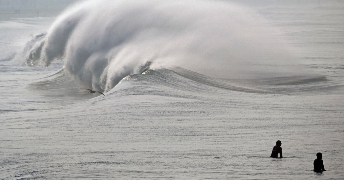 Powerful surf hits West Coast and Hawaii, flooding some low-lying areas