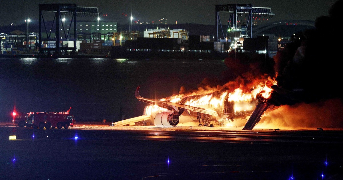 Passengers escape plane engulfed in flames at Japan airport