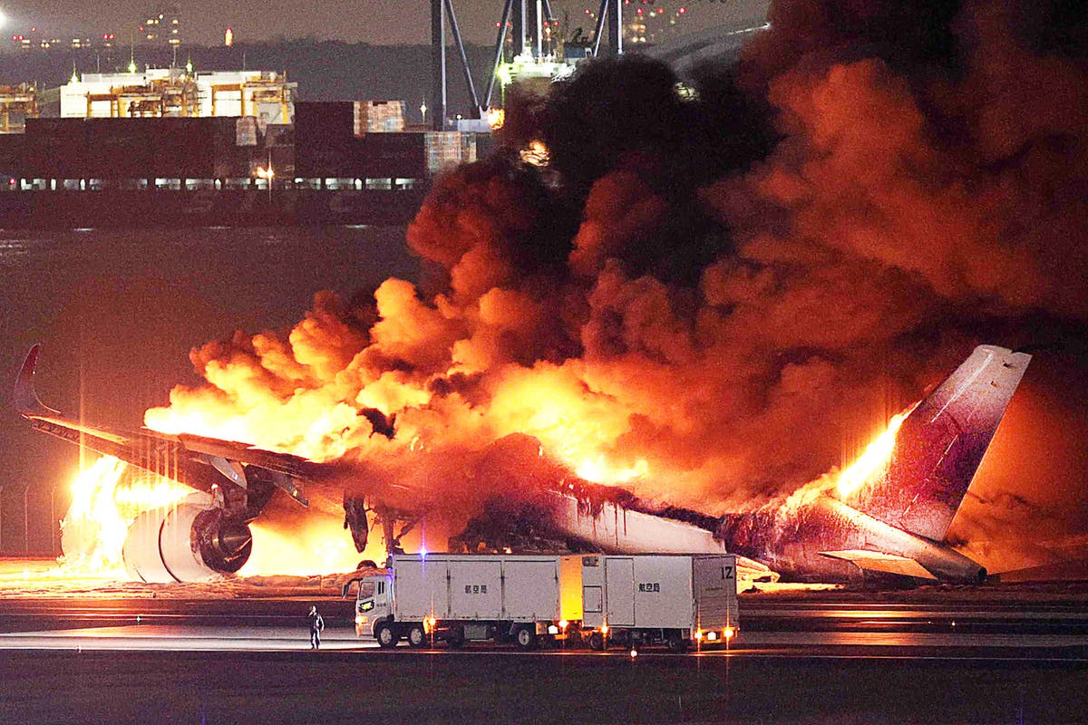 Five killed and more than a dozen injured in fiery plane crash in Japanese capital