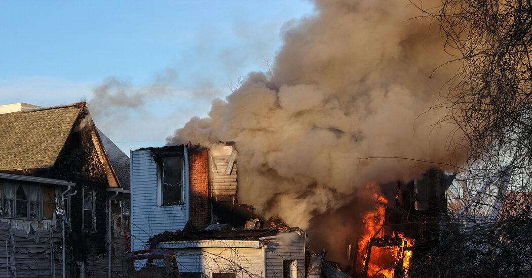 At Least 6 Are Said to be Missing After Fire at Home Where 2 Police Officers Were Shot