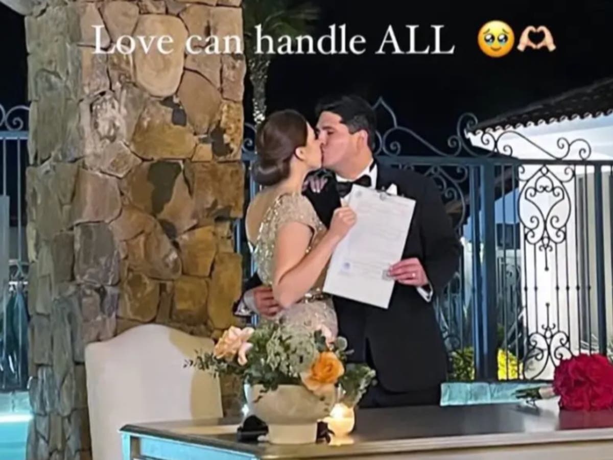 Bride’s dress splattered with red paint as she walks down aisle