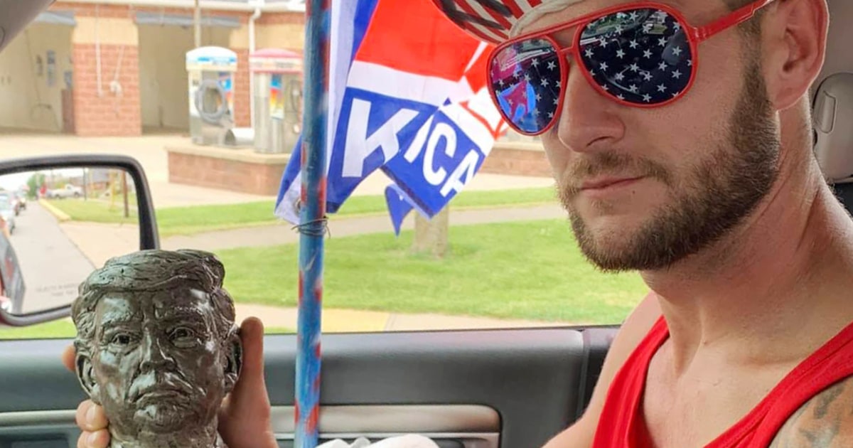 Jan. 6 rioter holding 'stop the steal' sign swung at officers with a Trump flag, FBI says