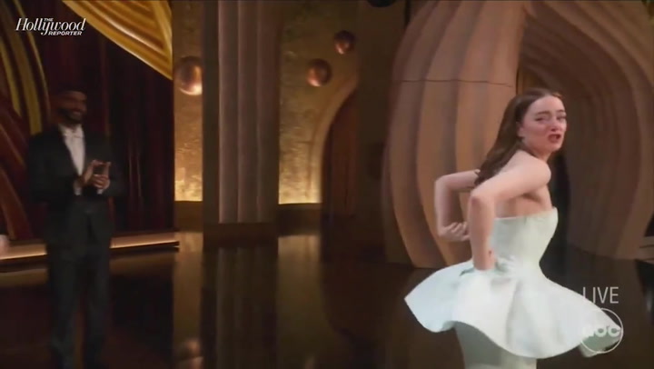 Emma Stone suffers wardrobe malfunction before sobbing as she accepts Best Actress Oscar